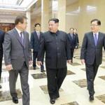 Kim Jong-un (center) met with envoys from South Korea in Pyongyang on Monday.