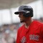 Boston Red Sox' Xander Bogaerts reacts after batting against Minnesota Twins starting pitcher Aaron Slegers during the first inning of a spring training baseball game, Friday, Feb. 23, 2018, in Fort Myers, Fla. (AP Photo/John Minchillo)