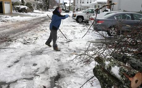 03/09/2018 North Andover Ma-Patrick Queenan (cq) cleans up his street in North Andover. He finally had his power restroed after 16 hours in the dark. Jonathan Wiggs /Globe Staff Reporter:Topic. 
