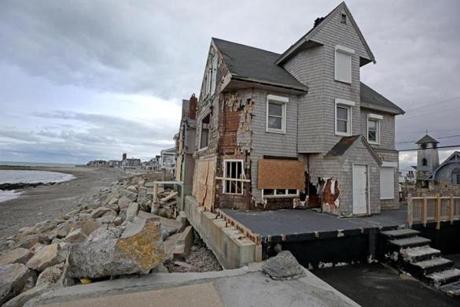MARSHFIELD, MA - 3/12/2018: Damaged seawall and home on Ocean St in Marshfield where boulders are piled on the beach. . (David L Ryan/Globe Staff ) SECTION: METRO TOPIC 13coastal
