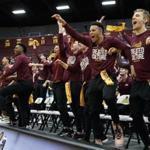 Loyola men's basketball players celebrate during the NCAA Tournament selection show. 
