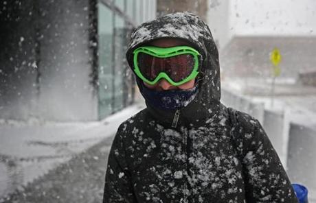 SNOW SLIDER3 BOSTON, MA - 3/13/2018: Julia Gorman of Boston has good use of her ski goggles that help with the vision along Saint James Ave during the blizzard. (David L Ryan/Globe Staff ) SECTION: METRO TOPIC stand alone photo
