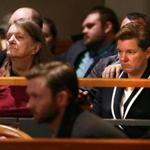 Kathleen Gilpin, left, and her daughter Massachusetts State Police Colonel Kerry Gilpin, right, listened as Michael Hand was arraigned in connection with the 1986 murder of Tracy Gilpin on Wednesday. 