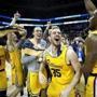 CHARLOTTE, NC - MARCH 16: The UMBC Retrievers bench reacts to their 74-54 victory over the Virginia Cavaliers during the first round of the 2018 NCAA Men's Basketball Tournament at Spectrum Center on March 16, 2018 in Charlotte, North Carolina. (Photo by Streeter Lecka/Getty Images)
