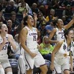 Connecticut's Katie Lou Samuelson (33), Gabby Williams (15), Kia Nurse (11), and Azurá Stevens (23) react on the sideline during the second half of a first-round game against Saint Francis (Pa.) in the NCAA women's college basketball tournament in in Storrs, Conn., Saturday, March 17, 2018. UConn won 140-52. (AP Photo/Jessica Hill)