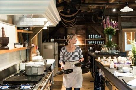 Chef-owner Erin French preps at?the Lost Kitchen in Freedom, Maine. The little restaurant in a former gristmill is?designed with an open concept that invites guests into the kitchen. 

