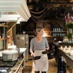 Chef-owner Erin French preps at?the Lost Kitchen in Freedom, Maine. The little restaurant in a former gristmill is?designed with an open concept that invites guests into the kitchen. 
