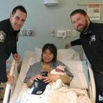 Officers Mike Butler and Brandon Carey helped deliver a baby boy in Dorchester on Tuesday morning, and later visited mom and son in the hospital.