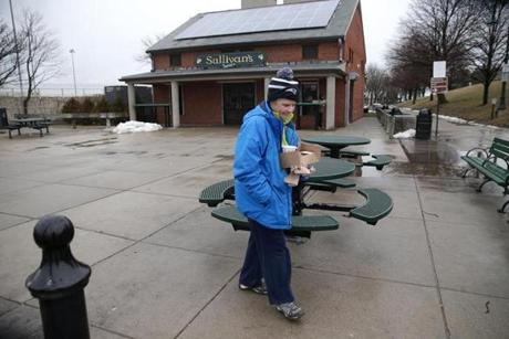 Mary Madden walked back to her car with her lunch from Sullivan's on Castle Island on Thursday.
