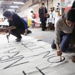Young activists painted signs to be carried at the upcoming March for Our Lives Los Angeles event.