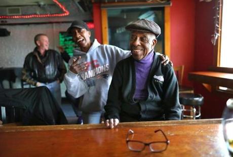 Roxbury- 03/23/18- Kim Jackson (left) greets Sonny Walker, 92, who arrived at his bar. He is shutting the doors of his bar, Sonny Walker Bar on Warren Street in Roxbury. He was one of the first black tavern owners in the city. Photo by John Tlumacki/Globe Staff(metro
