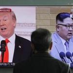 A man watched a television program featuring images of President Donald Trump (left) and North Korean leader Kim Jong Un during a news program at the Seoul Railway Station in South Korea.  