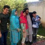 Malala Yousafzai, center, posed for a photograph with family members at her native home during a visit to Mingora, Pakistan.