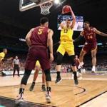 SAN ANTONIO, TX - MARCH 31: Moritz Wagner #13 of the Michigan Wolverines grabs the rebound against Marques Townes #5 and Aundre Jackson #24 of the Loyola Ramblers in the first half during the 2018 NCAA Men's Final Four Semifinal at the Alamodome on March 31, 2018 in San Antonio, Texas. (Photo by Tom Pennington/Getty Images)