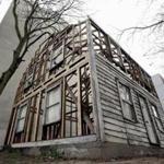 This Dec. 12, 2017 photo shows the rebuilt house of the civil rights activist Rosa Parks in Berlin, Germany. The small, tired house with peeling white paint once served as a refuge for Parks in Detroit. It has traveled across the world and back in an odyssey conceived by Mendoza and a Parks family member determined to preserve the civil rights activist's legacy. Volunteers are working to reconstruct the home as much as possible so that it can be displayed to the public for free Saturday, March 31, 2018, and Sunday. (AP Photo/Michael Sohn)