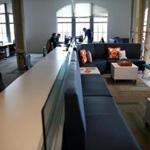 Office space abuts the common area at Janeiro Digital in Boston.