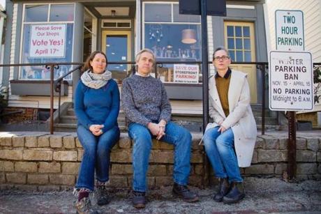 WISCASSET, ME - APRIL 5: Wiscasset business owners Stacy Linehan of Treats Bakery, James Kochan of James Kochan Fine Art and Antiques and Erika Soule of Rock Paper Scissors sit outside Soule?s shop on Thursday, April 5, 2018 . The Maine Department of Transportation?s plan to eliminate on-street parking in the town, in order to widen the travel lanes and reduce bottlenecks during the summer tourist season, is being met by opposition by the three owners. (Carl D. Walsh for The Boston Globe)
