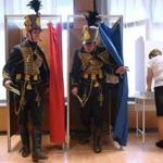 Hungarian voters wearing traditional hussar cavalry uniforms cast ballots at a polling station in Vac, north of Budapest. Viktor Orban?s party and its ally won a major victory.