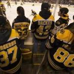 Boston, Ma-March 10, 2018-Globe Staff- Stan Grossfeld- Boston Bruins vs. Chicago Blackhawks at TD Garden-- Bruins fans in an assortment of jerseys watch warmups, hoping a player will toss them a puck. 