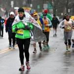 Runners battled the rain when heading up Heartbreak Hill in 2015.