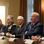 President Donald Trump is flanked by Vice President Mike Pence, left, and National Security Adviser John Bolton as he speaks to reporters during a meeting with senior military leaders at the White House on Monday, April 9, 2018. Trump criticized the FBI raid on the office of his longtime personal attorney, Michael Cohen. (Tom Brenner/The New York Times) 