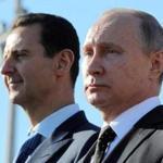 FILE - This Dec. 11, 2017 file photo, shows Russian President Vladimir Putin, right, and Syrian President Bashar Assad watching troops march at the Hemeimeem air base in Syria. In comments published on the official presidency Telegram channel Wednesday, March 14, 2018, Assad said his country's war on terrorism will continue as long as there is 