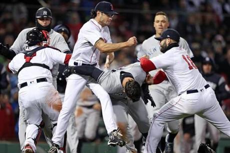 Boston, MA: 4/11/18: Red Sox pitcher Joe Kelly punches the Yankees Tyler Austin after he charged the mound in the 7th inning. The Boston Red Sox hosted the New York Yankees in a regular season MLB baseball game at Fenway Park. (Jim Davis/Globe Staff)

