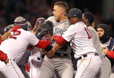 Boston, MA: 4/11/18: The Yankees Aaron Judge has Red Sox pitcher Joe Kelly in a headlock dUring the seventh inning brawl. The Boston Red Sox hosted the New York Yankees in a regular season MLB baseball game at Fenway Park. (Jim Davis/Globe Staff)
