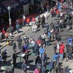 Fans enjoyed the sights of Yawkey Way outside of Fenway Park before the Red Sox home opener last week.  