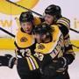 Boston04/12/18 Stanley Cup Playoffs- Bruins vs Maple Leafs- David Pasternak is hugged by Brad Marchand and Charlie McAvoy after Pasternak's 2nd period goal put the Bruins up, 3-1. Bruins Photo by John Tlumacki/Globe Staff(sports)
