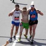 Two fellow runners helped Ari Ofsevit (center) across the finish line at the 2016 Boston Marathon.