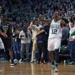 Boston, MA: 4/15/18: The Celtics Terry Rozier III, (right) made the crowd come out of their seats after he hit a three pointer with .5 seconds left in the fourth quarter to give Boston a 99-96 lead. Teammate Al Horford is at left. The Boston Celtics hosted the Milwaukee Bucks in Game One of an Eastern Conference First Round NBA Playoff basketball game at the TD Garden. (Jim Davis/Globe Staff)