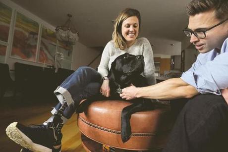 Jessica Kensky and Patrick Downes with Kensky?s service dog, Rescue. 
