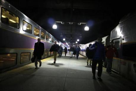 Passengers walked to their commuter trains on the platform at South Station earlier this month. 
