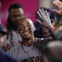 Mookie Betts was congratulated by his Red Sox teammates in the the eighth inning after he hit his third home run Tuesday in Anaheim, Calif.