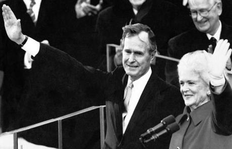 BARBARA SLIDER Washington, D.C - 1/20/1989: President George HW Bush, left, and his wife, First Lady Barbara Bush, wave from the platform after being sworn in as the 41st President of the United States during the Inaugural Ceremonies at the United States Capitol in Washington, D.C., on Jan. 20, 1989. (Paul R. Benoit/Globe Staff) --- BGPA Reference: 170119_MJ_002 
