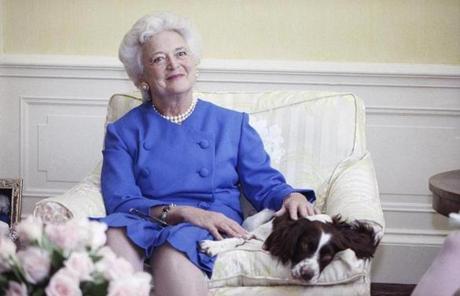 BARBARA SLIDER FILE - In this 1990 file photo, first lady Barbara Bush poses with her dog Millie in Washington. A family spokesman said Tuesday, April 17, 2018, that former first lady Barbara Bush has died at the age of 92. (AP Photo/Doug Mills, File)
