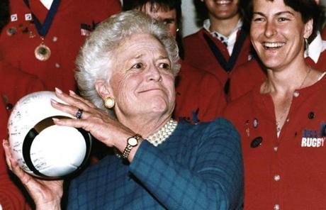BARBARA SLIDER (FILES) In this file photo taken on February 06, 1992 former US First Lady Barbara Bush prepares to throw a rugby ball in Washington, DC, after receiving it from Mary Sullivan (R), captain of the US national women's rugby team. The US team, which won the World Cup, received the Team Spirit Award from Mrs. Bush. Former US first lady Barbara Bush died Tuesday, April 17, 2018 at the age of 92, her husband's office said. 