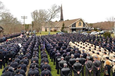Police from all over the country stood outside the church Wednesday.
