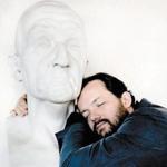 Andris Nelsons, BSO music director, nuzzles a bust of Austrian composer Anton Bruckner. 