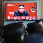 FILE - In this April 21, 2018 file photo, people watch a TV screen showing an image of North Korean leader Kim Jong Un during a news program at the Seoul Railway Station in Seoul, South Korea. The signs read: 