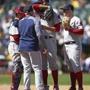 Boston Red Sox pitcher David Price wipes his face as he is visited on the mound by pitching coach Dana LeVangie during the eighth inning of a baseball game against the Oakland Athletics Sunday, April 22, 2018, in Oakland, Calif. (AP Photo/Ben Margot)