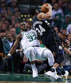 Boston, MA: 4-24-18: The Bucks Giannis Antetokounmpo knocks down the Celtics Semi Ojeleye on a second quarter drive to the hoop, but the foul was called on Ojeleye. The Boston Celtics hosted the Milwaukee Bucks for Game Five of their NBA Eastern Conference first round playoff series at the TD Garden. (Jim Davis/Globe Staff)
