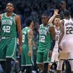 Milwaukee, WI: 4-26-18: The Celtics Al Horford (42) iand Terry Rozier III (12) are not looking thrilled as the Bucks Matthew Dellavedova high fives teammate Khris Middleton (22) as the clock winds down in the fourth quarter. The Boston Celtics visited the Milwaukee Bucks for Game Six of their NBA Eastern Conference first round playoff series at the Bradley Center. (Jim Davis/Globe Staff)