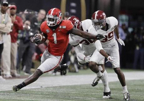 Georgia running back Sony Michel runs doer a first down during the first half of the NCAA college football playoff championship game against Alabama Monday, Jan. 8, 2018, in Atlanta. (AP Photo/David J. Phillip)
