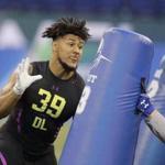 Boston College defensive lineman Harold Landry runs a drill during the NFL football scouting combine, Sunday, March 4, 2018, in Indianapolis. (AP Photo/Darron Cummings)