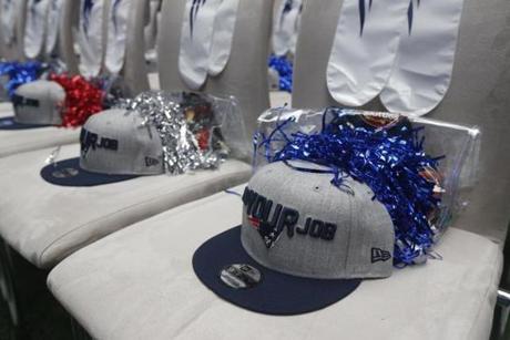 New England Patriots hats are shown prior to the first round of the 2018 NFL football draft, Thursday, April 26, 2018, in Arlington, Texas. (AP Photo/Michael Ainsworth)
