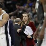San Antonio Spurs assistant coach Becky Hammon, center, during the second half of an NBA basketball game against the New York Nets, Tuesday, Dec. 26, 2017, in San Antonio. San Antonio won 109-97.(AP Photo/Eric Gay)