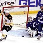 Tampa, Florida - 4/28/2018 - (3rd period) Boston Bruins left wing Brad Marchand (63) scores on Tampa Bay Lightning goaltender Andrei Vasilevskiy (88) for the 4-2 lead in the third period. The Boston Bruins visit the Tampa Bay Lightning in Game One of the second round of the Stanley Cup Playoffs at Amalie Arena in Tampa, FL. - (Barry Chin/Globe Staff), Section: Sports, Reporter: Kevin P. Dupont , Topic: 29Bruins-Lightning, LOID: 8.4.1746780919.