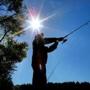 Joe Burke from Randolph cast his fishing line under a brilliant sun at Houghtons Pond in Milton.